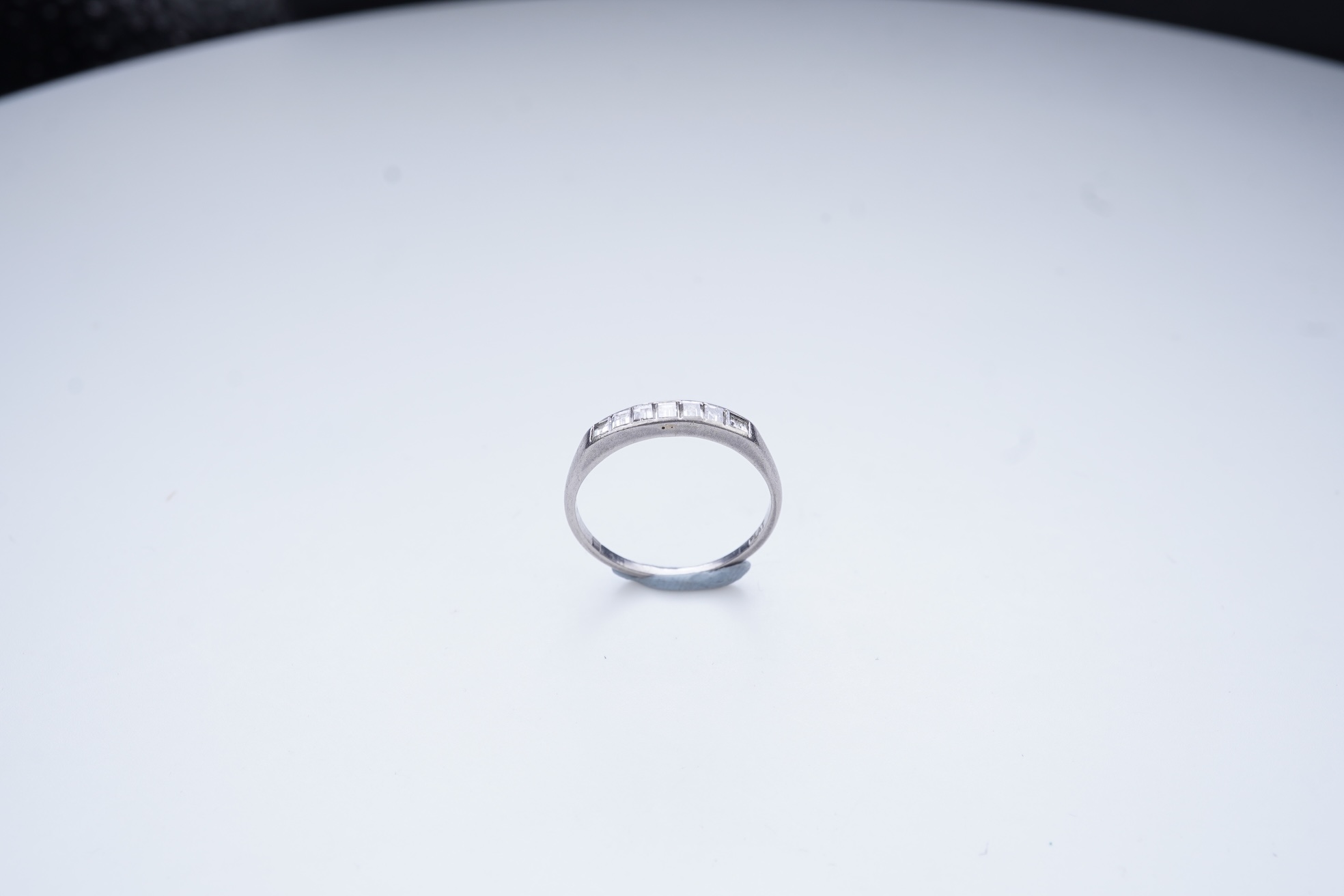A diamond half-eternity ring, first half 20th century
